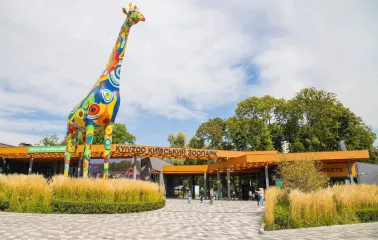 Large colorful giraffe sculpture at the entrance to the Kyiv Zoo