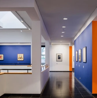 Art gallery with works on blue walls at Mystetskyi Arsenal