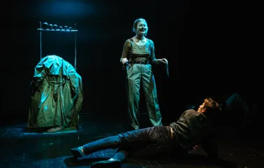 Molodyi Teatr in Kyiv - emotional stage performance with a smiling actress standing over an actor lying on the floor