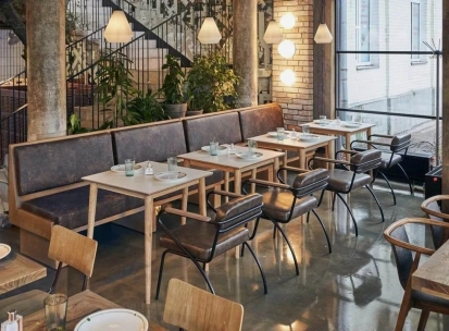 Shalom - modern dining room interior with unique wall art and low hanging lamps