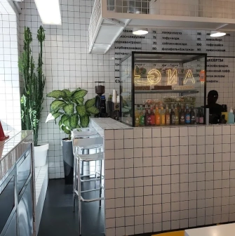 Fruit & Veg - bar counter with colorful displayed fruits vegetables and fresh juices