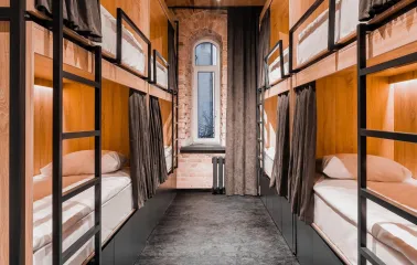 Globe Runner Hostel - corridor leading to hostel rooms with clear signage