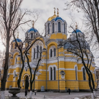 St. Volodymyr's Cathedral in Kyiv - exterior of a yellow church with blue domes