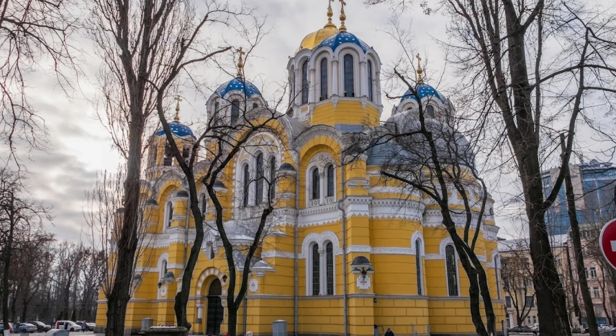 St. Volodymyr's Cathedral in Kyiv - exterior of a yellow church with blue domes