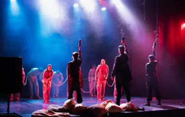 Mala Opera in Kyiv - dramatic theatrical performance with actors raising props amidst a haze of bubbles