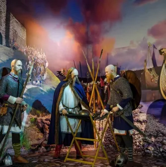 Muzei Stanovlennia Ukrainskoi Natsii in Kyiv - dramatic diorama of medieval warriors in chainmail planning a campaign near a wooden Viking ship