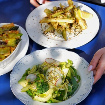 Restaurant Zigzag - three dishes on a table including a salad and asparagus