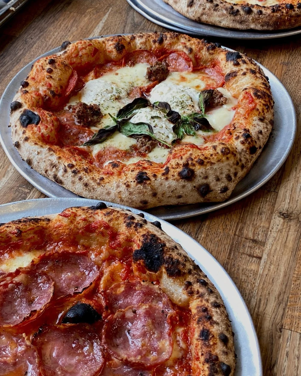 Pizza with sausage and cheese at Pie Spot