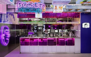 Street Kim - close-up view of the busy bar counter and serving area with many bottles