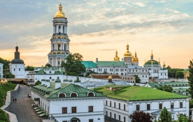 Kyiv Pechersk Lavra at sunset with a bell tower