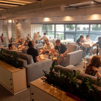 Fatum - guests smoking hookah and talking in lounge area