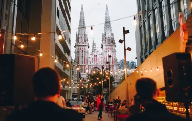 One Love Coffee in Kyiv - outdoor terrace with string lights and cathedral view