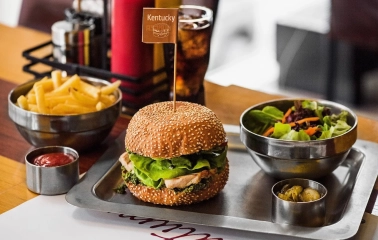 The Burger - Kentucky burger with fries and salad on metal tray