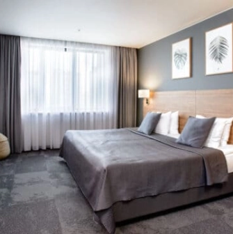 Superior room at Favor Park Hotel in Kyiv with a king-size bed