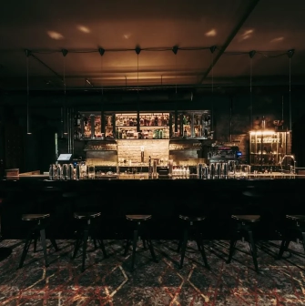 Beatnik Bar - close-up view of the minimalist bar counter and shelf display