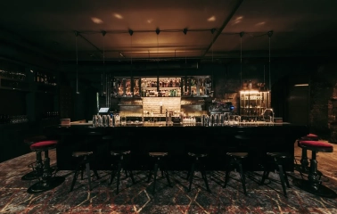 Beatnik Bar - close-up view of the minimalist bar counter and shelf display