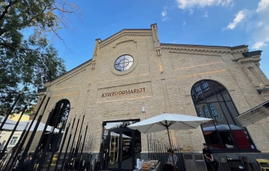 Kyiv Food Market - historic building facade with arched windows and entrance