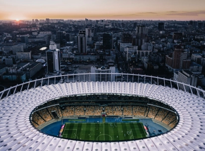 NSC Olimpiyskiy in Kyiv - stunning aerial evening view looking down into the illuminated stadium bowl
