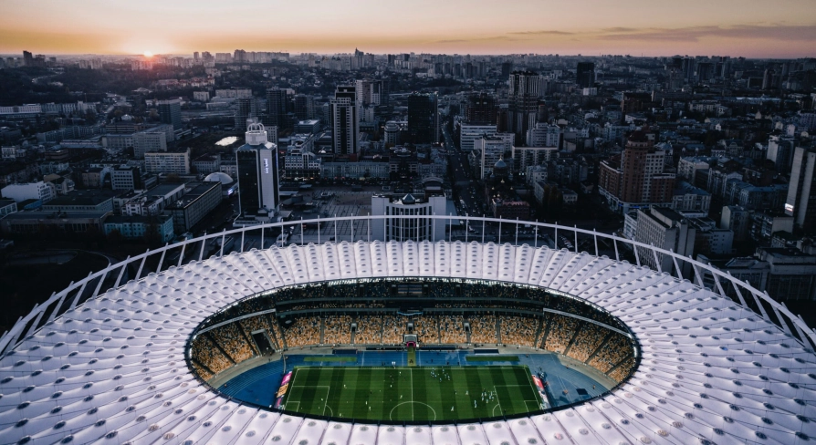NSC Olimpiyskiy in Kyiv - stunning aerial evening view looking down into the illuminated stadium bowl