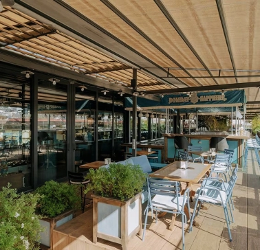 Summer terrace of Milk Bar TSUM restaurant in the center of Kyiv
