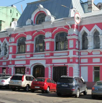 Mala Opera in Kyiv - striking historic pink and white facade of the theater featuring ornate architectural details and arched windows