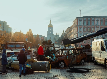 St. Michael's Cathedral in Kyiv - destroyed cars and missile part on square