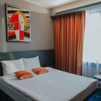 Standard room at the Mercure Kyiv Congress Hotel with a king-size bed