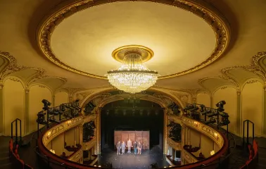 Teatr Franka in Kyiv - grand view from the upper circle looking down past a massive crystal chandelier onto the stage
