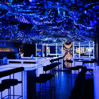 Sansara - stylish interior with mirrored walls and low hanging light fixtures