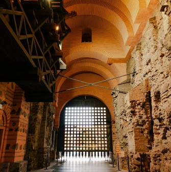 Golden Gate in Kyiv - interior view of the ancient stone passage with brick arches and the wooden portcullis gate