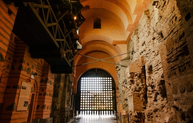 Golden Gate in Kyiv - interior view of the ancient stone passage with brick arches and the wooden portcullis gate