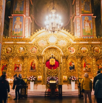 St. Michael's Cathedral in Kyiv - golden baroque iconostasis with visitors
