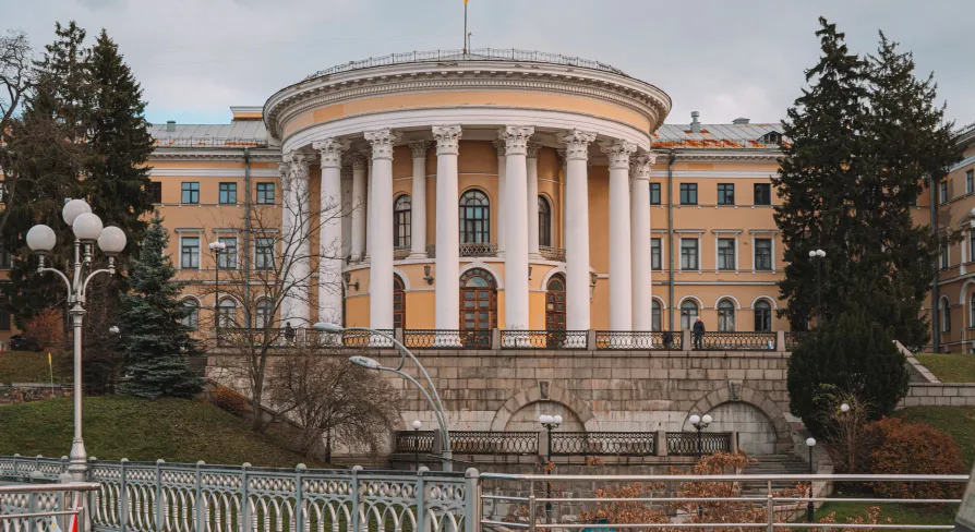 October Palace in Kyiv - exterior view of the yellow rotunda with white columns