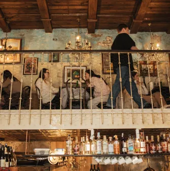 The interior of the second floor of the Mimosa Brooklyn Pizza restaurant in Kyiv with visitors