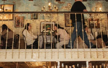 The interior of the second floor of the Mimosa Brooklyn Pizza restaurant in Kyiv with visitors