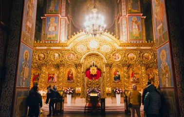 St. Michael's Cathedral in Kyiv - golden baroque iconostasis with visitors