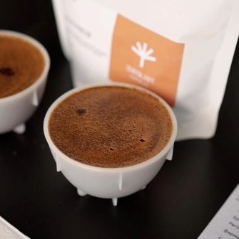 Idealist Coffee - close-up of a cup of freshly brewed coffee