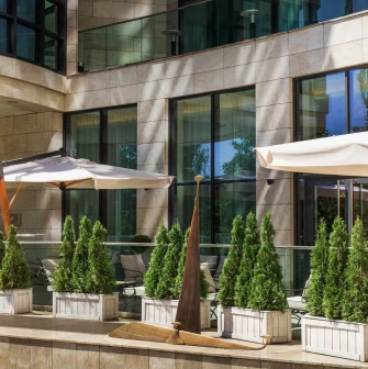 Hilton Kyiv - elegant restaurant terrace with tables and panoramic city view
