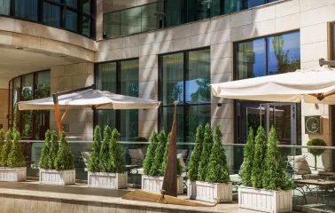 Hilton Kyiv - elegant restaurant terrace with tables and panoramic city view