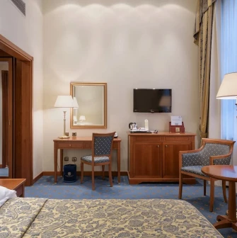 Premier Palace - luxurious hotel room with classic furniture and city view