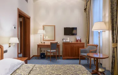 Premier Palace - luxurious hotel room with classic furniture and city view