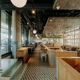 View of the Milk Bar terrace in TSUM through panoramic windows