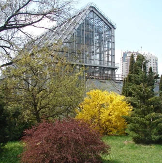 Spring trees and glass greenhouse at the Fomin Botanical Garden in Kyiv