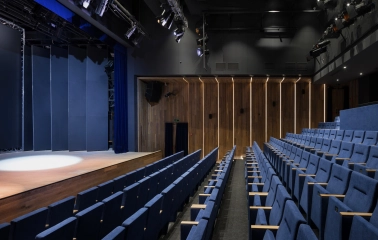 Teatr na Podoli in Kyiv - empty modern stage with blue velvet seating rows