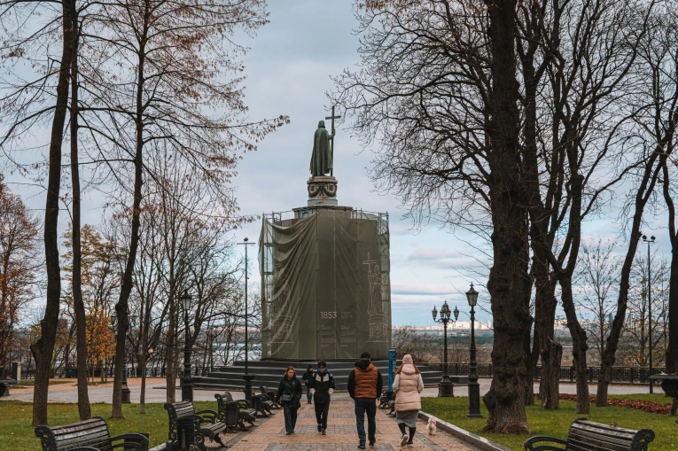 St. Volodymyr Monument in Kyiv - statue with scaffolding viewed from the park path