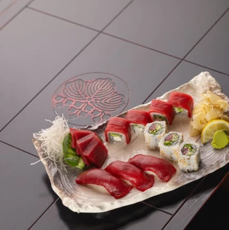 Assorted sushi and sashimi on a platter at Fujiwara Yoshi restaurant in Kyiv