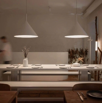 Restaurant 100 Rokiv Tomu Vpered - minimalist dining area with a long white communal table