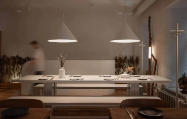Restaurant 100 Rokiv Tomu Vpered - minimalist dining area with a long white communal table
