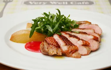Restaurant Very Well Cafe - close-up view of a steak dish with potato wedges and fresh herbs