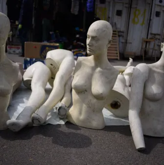 Mannequins on the floor of a flea market near Pochaina in Kyiv